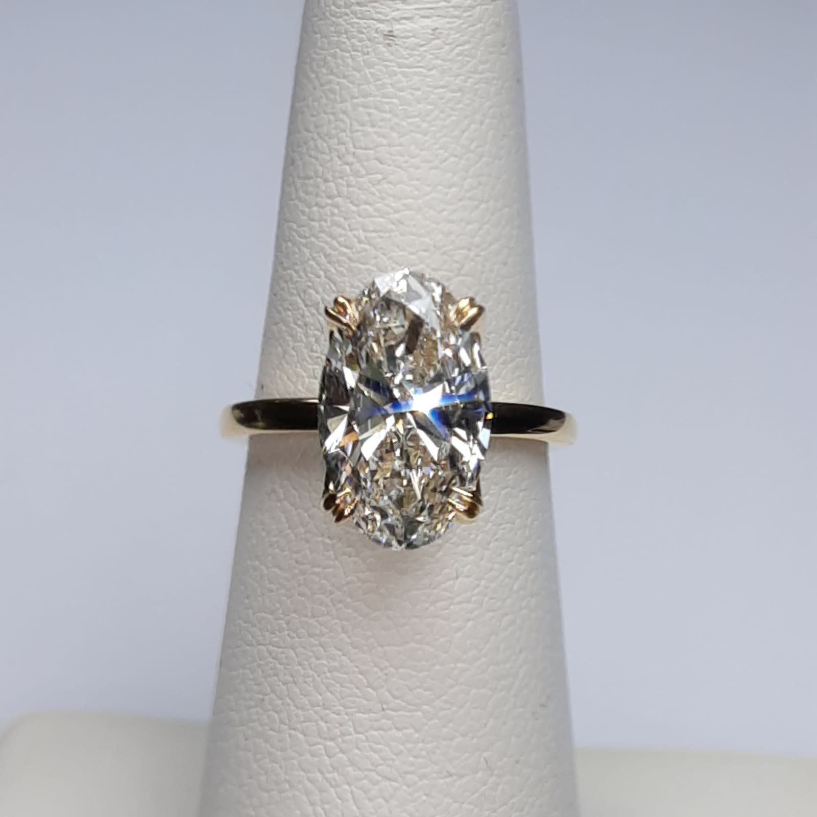 Front view of the 3.25 ct elongated oval diamond engagement ring in 18K yellow gold.
